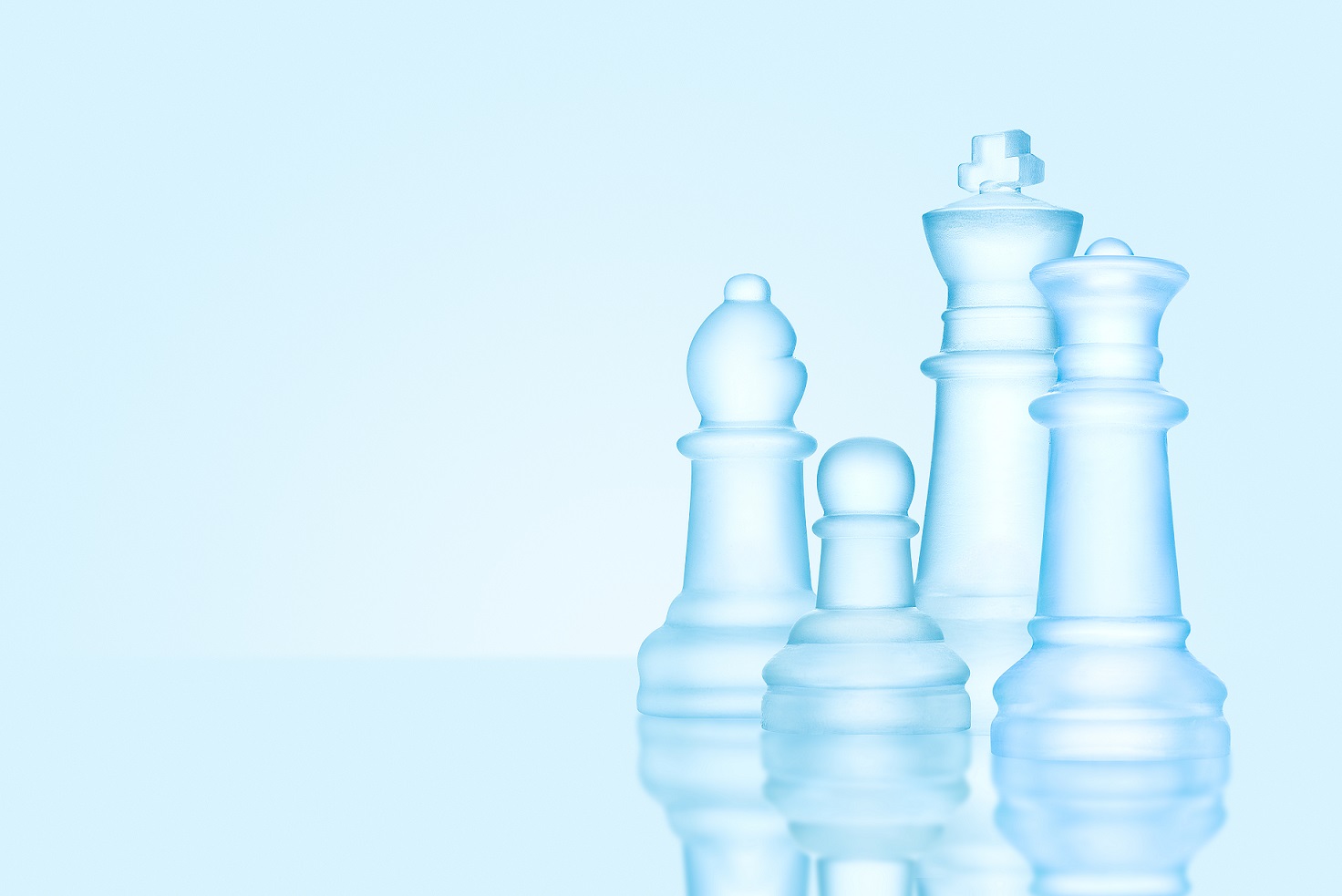 Chess family. Strategy and leadership concept; frosted chess figures made of ice, standing together ready for game as on a family photo.